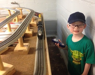 Luke playing with train